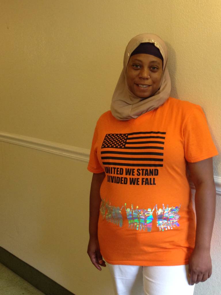 a photo of Naila Goodwin wearing the Code Orange t-shirt