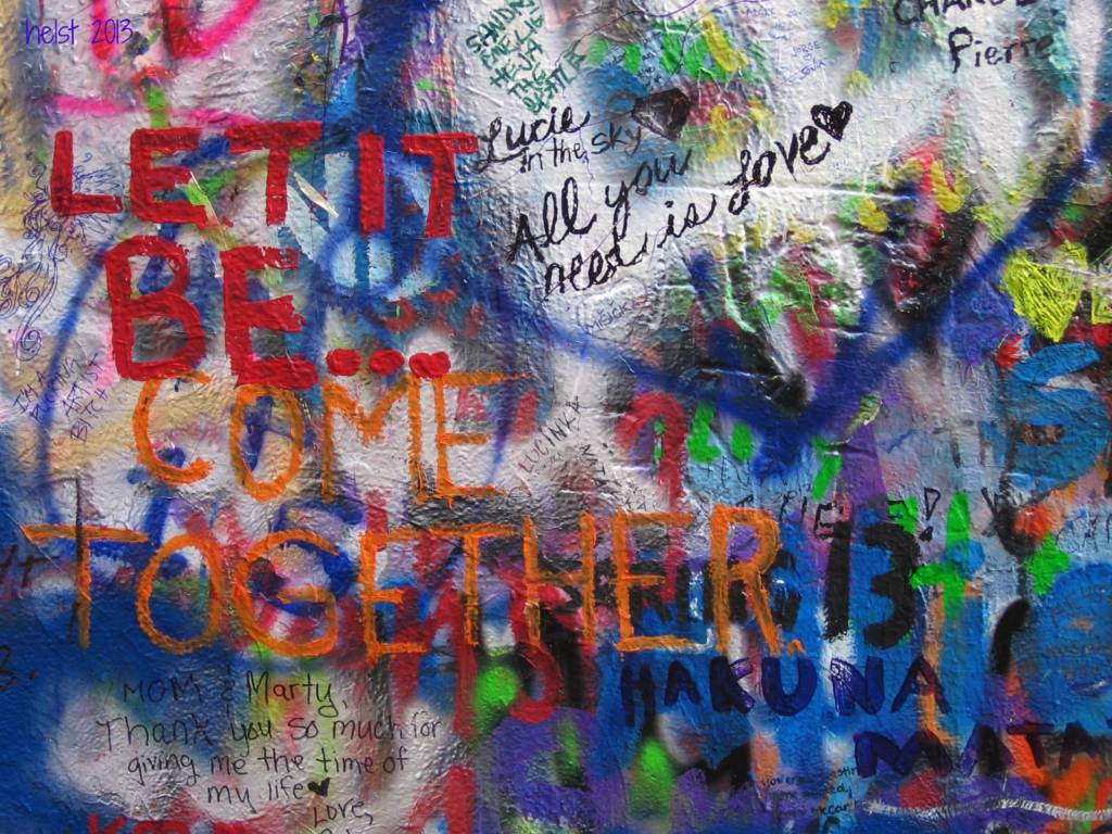 Photograph of wall with "Let It Be, Come Together" words painted on