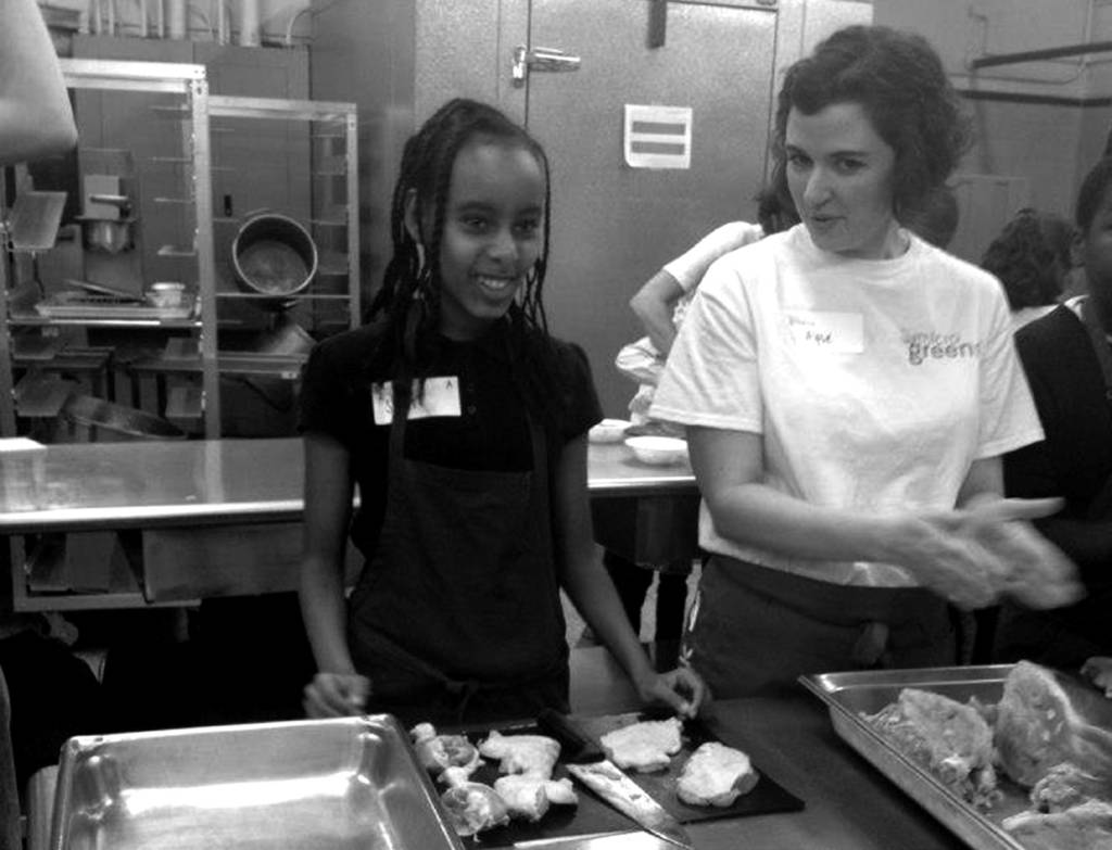 Photograph of a Shaw student learning how to cook