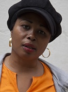 Portrait photo of Evelyn Nnam from the shoulders up.
