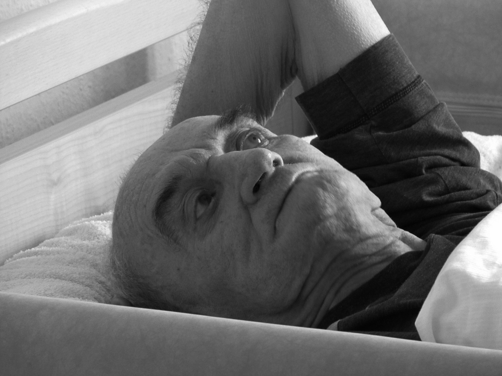 Older man in a hospital bed