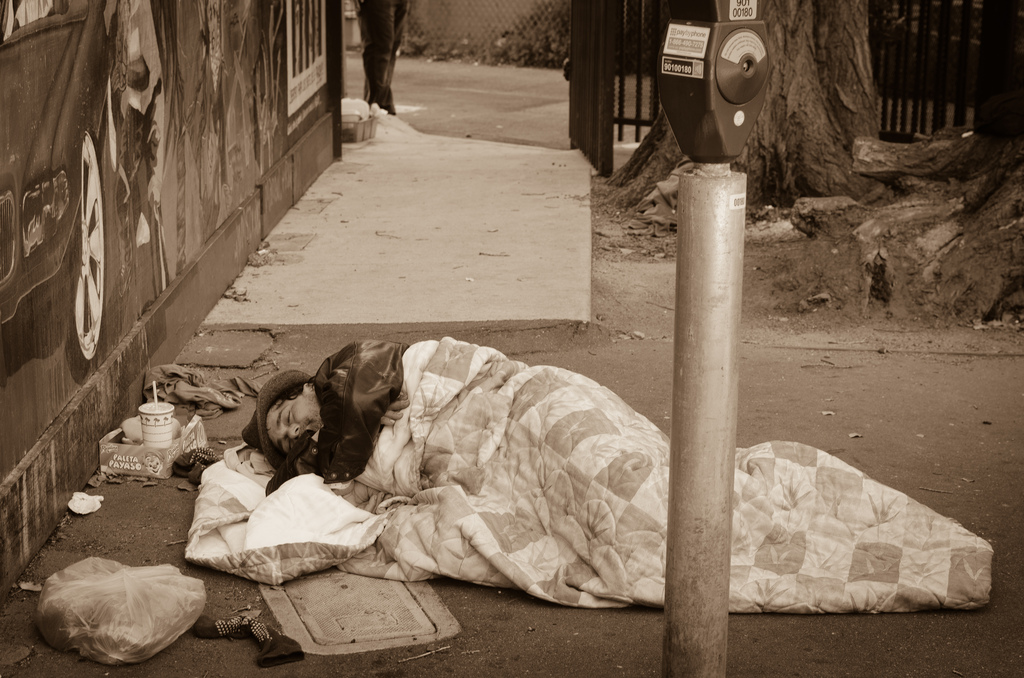 Homeless man Sleeping in a Parking Lot