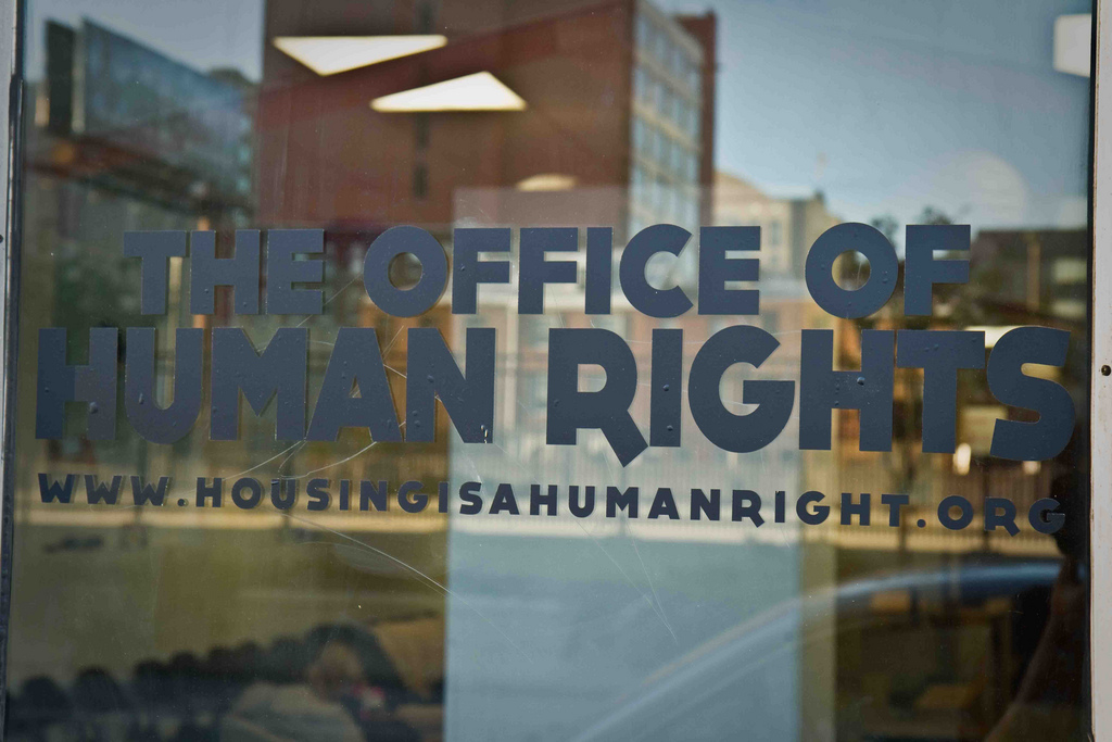 Window reading "The Office of Human Rights"