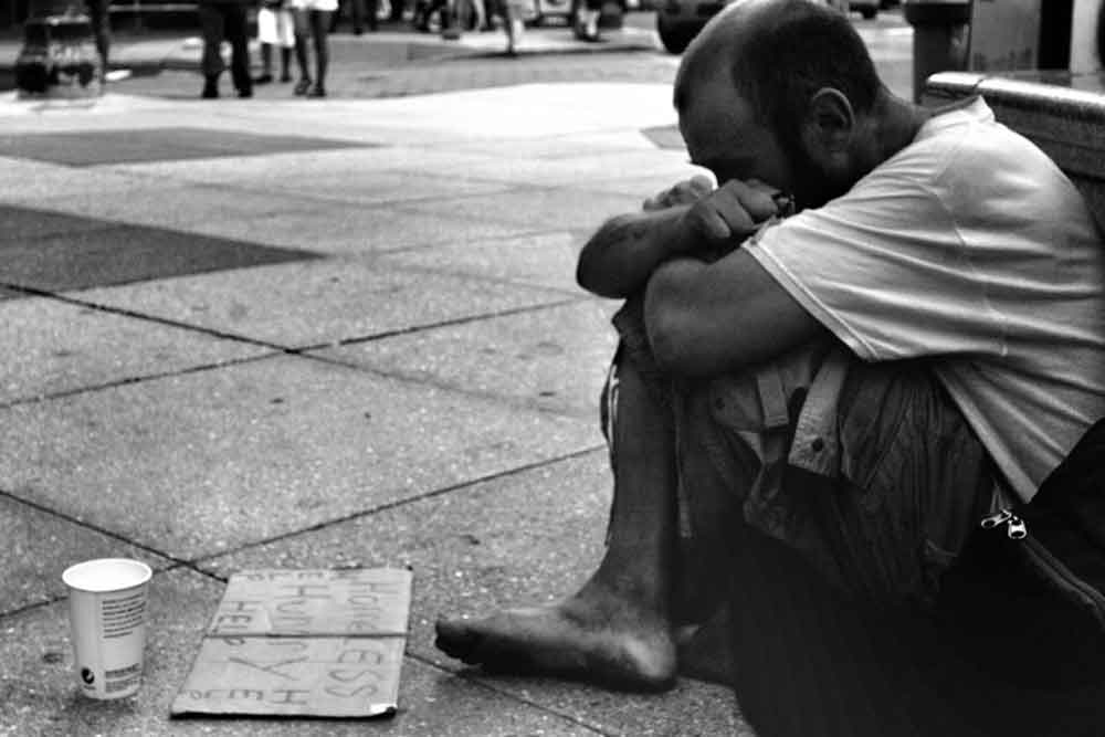 homeless man on sidewalk