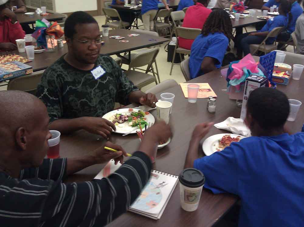 students chat with guests of youth service opportunity service dinner