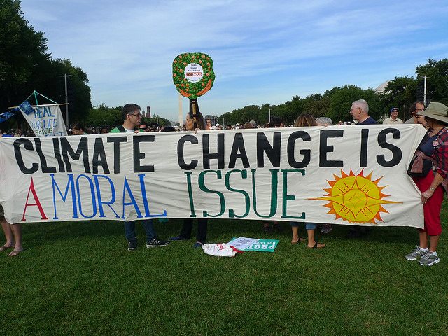 Image of a banner with the words "Climate Change is a Moral Issue."