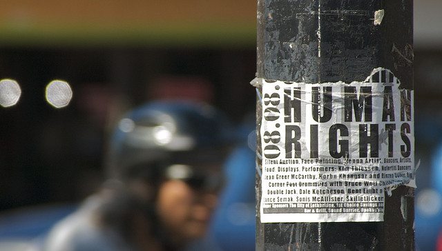 Photo of a Human Rights sticker on a lightpole