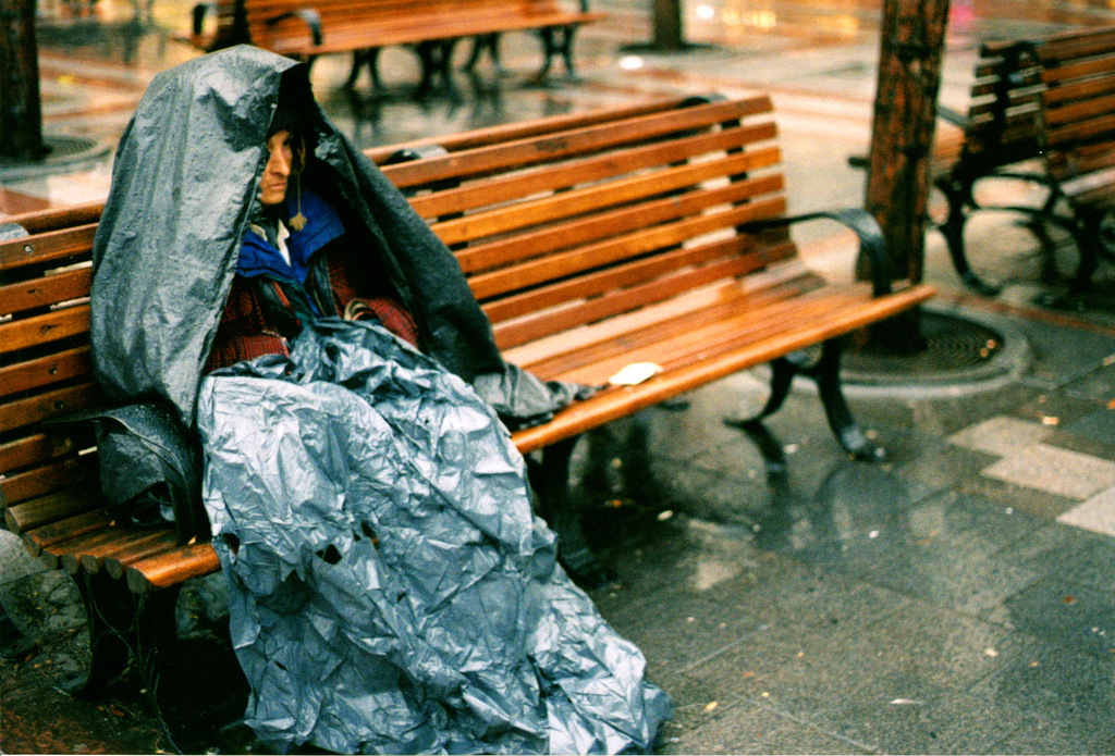 Photo of a Seattle homeless woman in the rain.