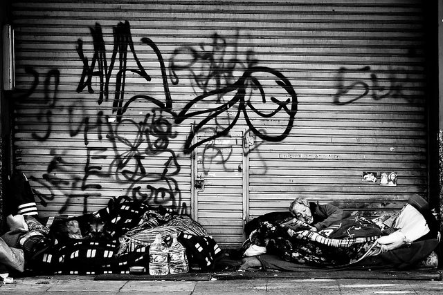 Image of homeless men on the street.