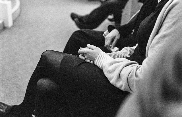 Photo of clasped hands at a funeral