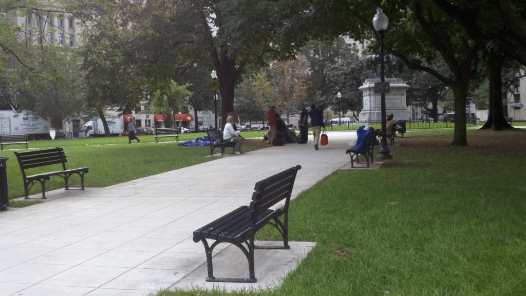People relaxing in the McPherson Square park in DC.