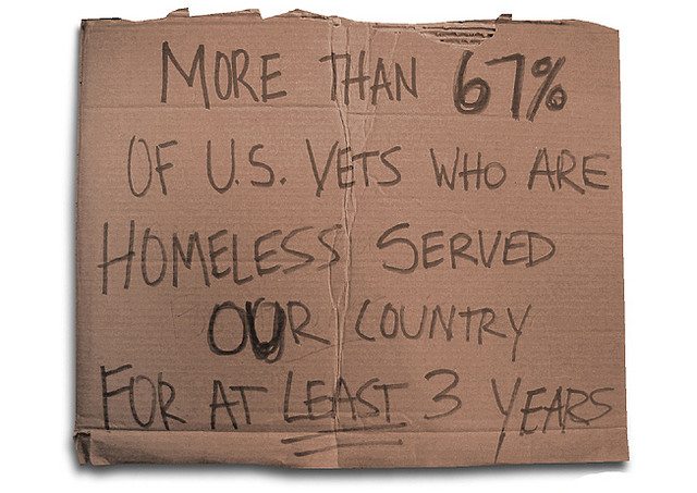 Image of a cardboard sign that says, "More than 67 percent of U.S. Vets who are homeless served our country for at least 3 years."