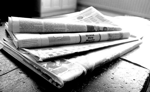 Image of a stack of newspapers.