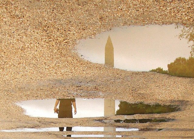Image of the Washington Monuments in a puddle.