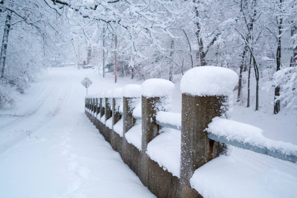 A bridge covered in snow