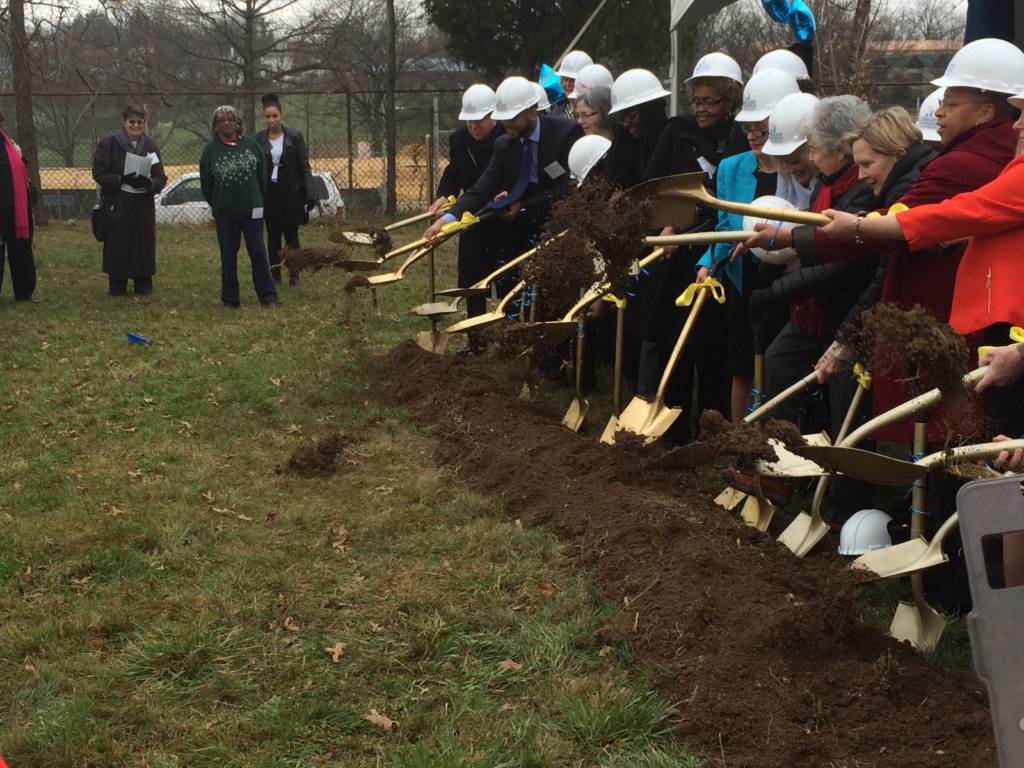 Community members break ground at the location of the new Bright Beginnings facility in Ward 8.