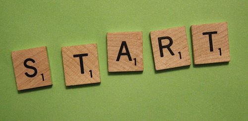 Scrabble letters spelling out "START"