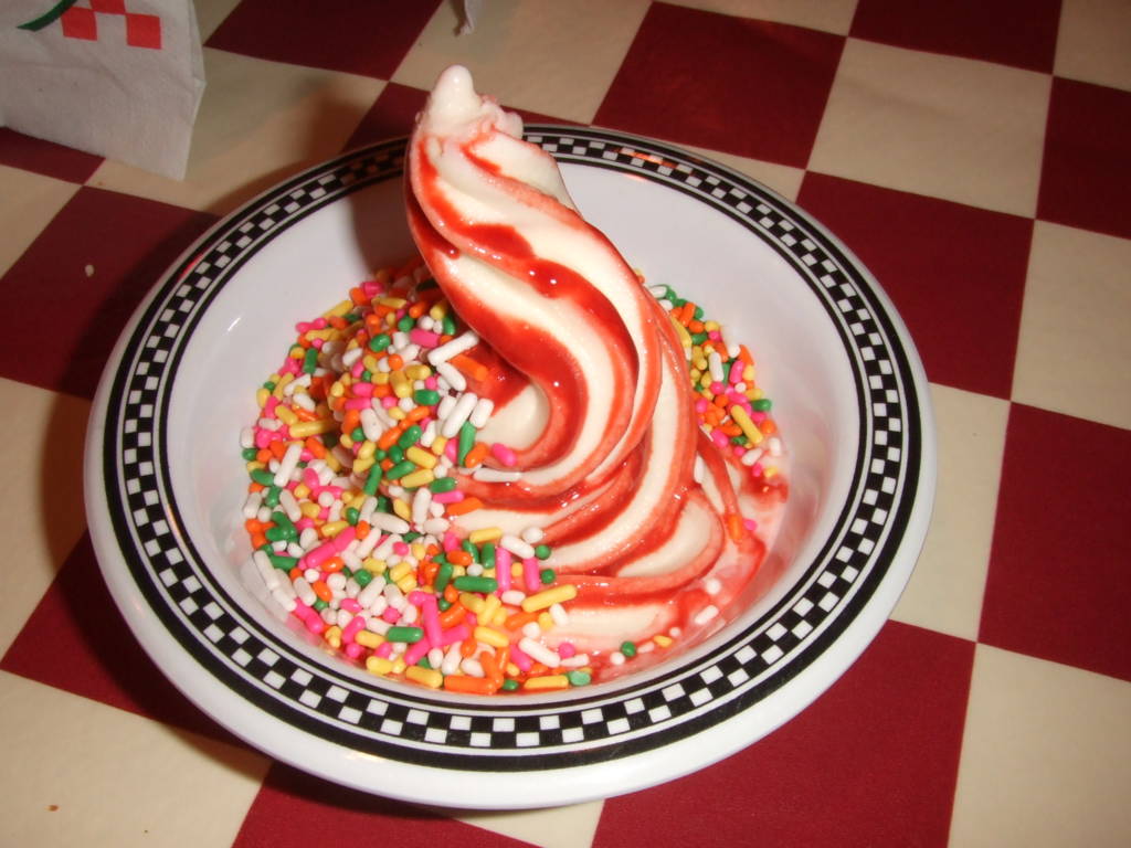Photo of soft serve ice cream with sprinkles.