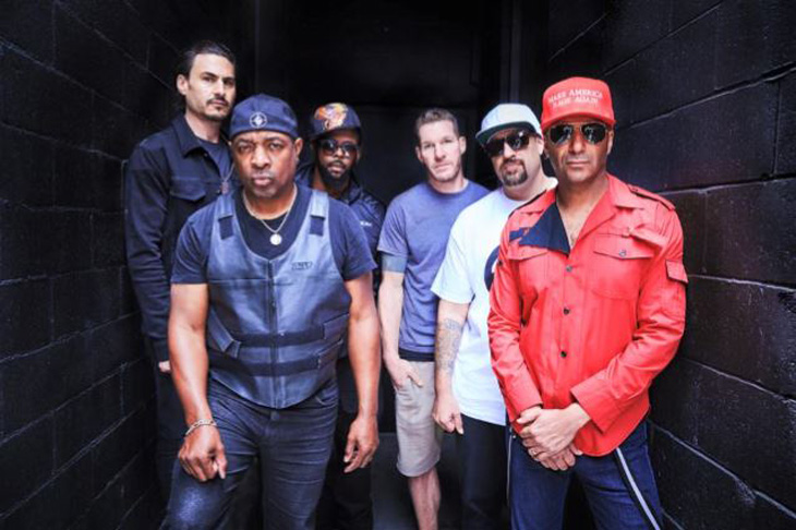 A promo photo showing drummer Brad Wilk, MC Chuck D, turntabalist DJ Lord, bassist Tim Commerford, MC B-Real, and guitarist Tom Morello.
