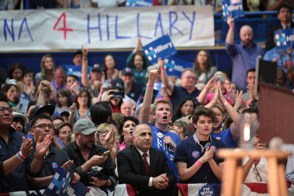 A massive crowd of Hillary supporters cheers at a rally.