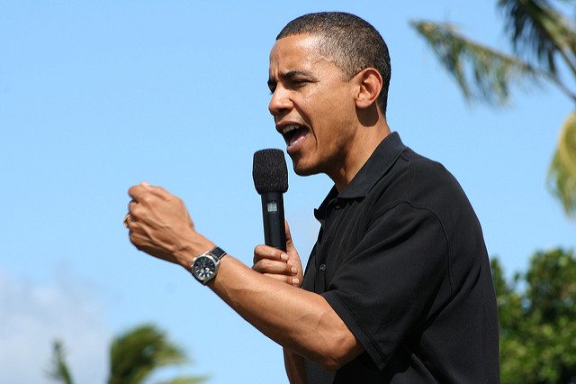 Obama speaking into microphone in Hawaii