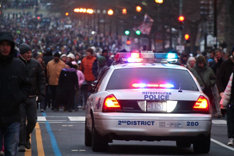 A photo with a DC police car among a crowd.