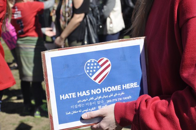 A photo of a sign that says "Hate has no home here"