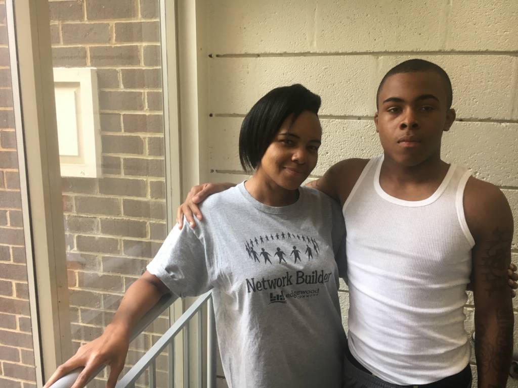 A photo of Elijah Payne and his mom outside of their apartment