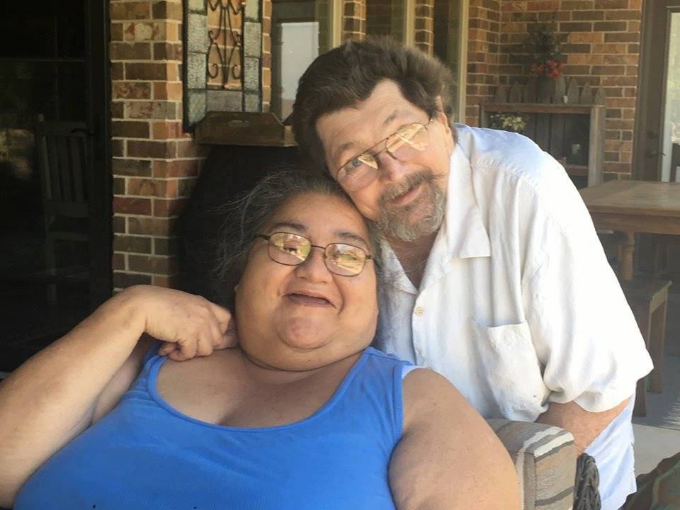 Annette Karnes and her husband Stephen Karnes pose for a photo in their home.
