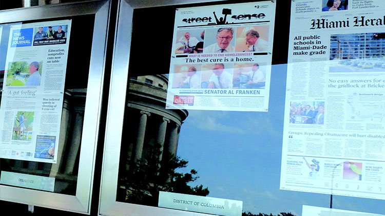 An issue of Street Sense in the Newseum's outdoor front page display.