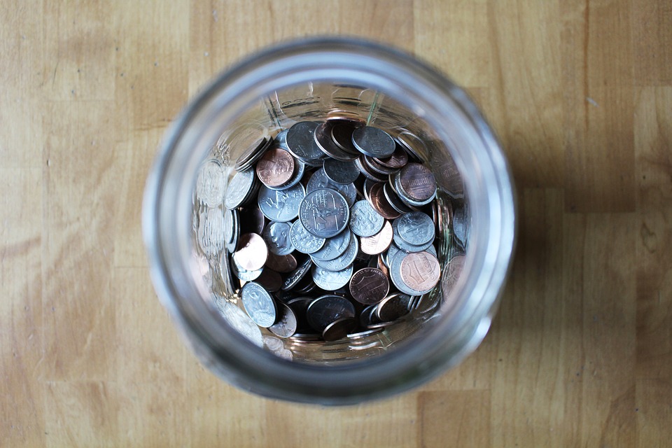 A jar full of change (coins)