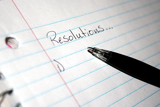 A picture of someone writing down their resolutions