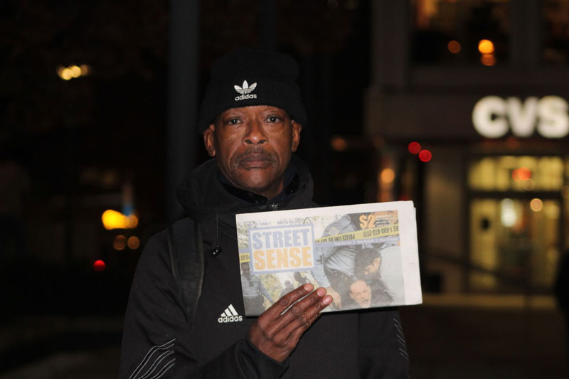 Photo of our customer, David, holding up a copy of Street Sense