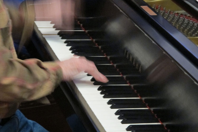 Photo of a man playing the piano