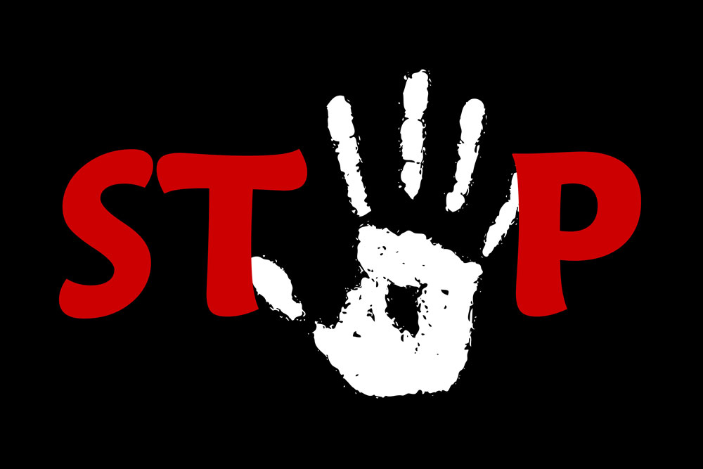 A graphic representation of the word "stop" in red lettering, with a white handprint in place of the letter "o."