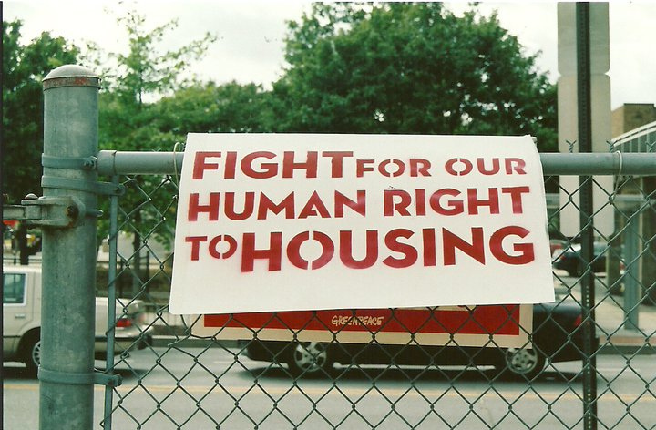 Sign that says "Fight for our human right to housing"