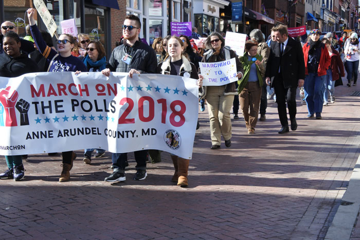Photo of people marching in the Annapolis anniversary Women's March on Jan. 20.