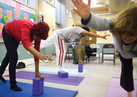 Yoga participants practice their balance.