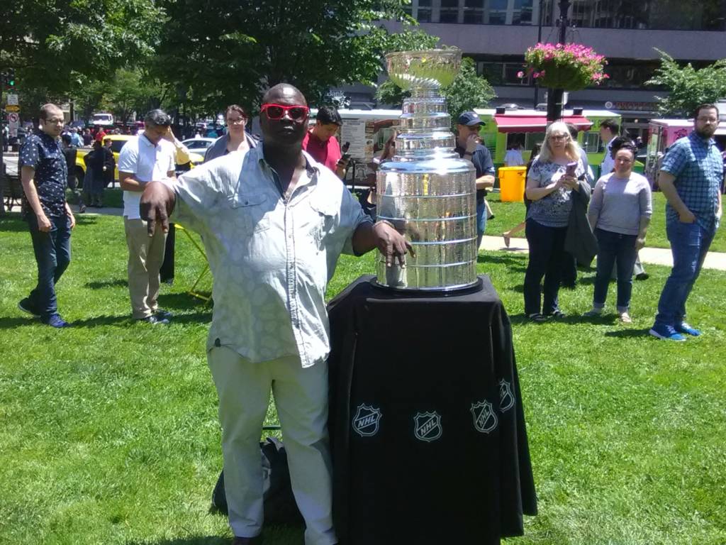 A photo of James Davis with the Stanley Cup in downtown D.C.