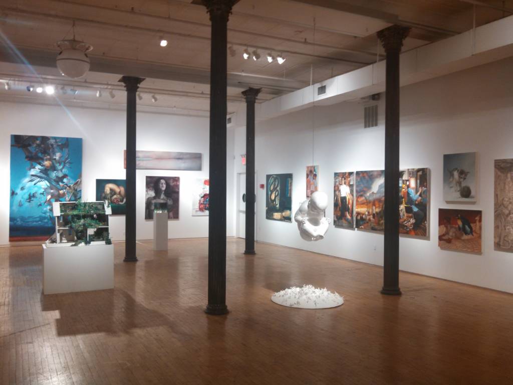 Image of an empty gallery room filled with art.