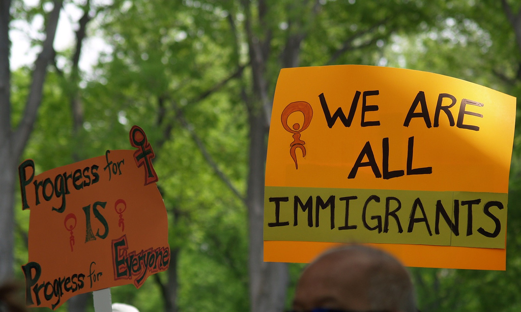 Image of immigration poster at rally.
