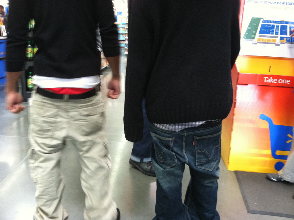 Two teens wear sagging pants exposing their underwear.