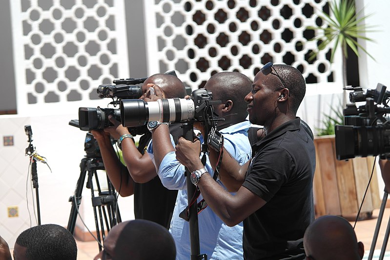 A photograph of a group of photographers at work.