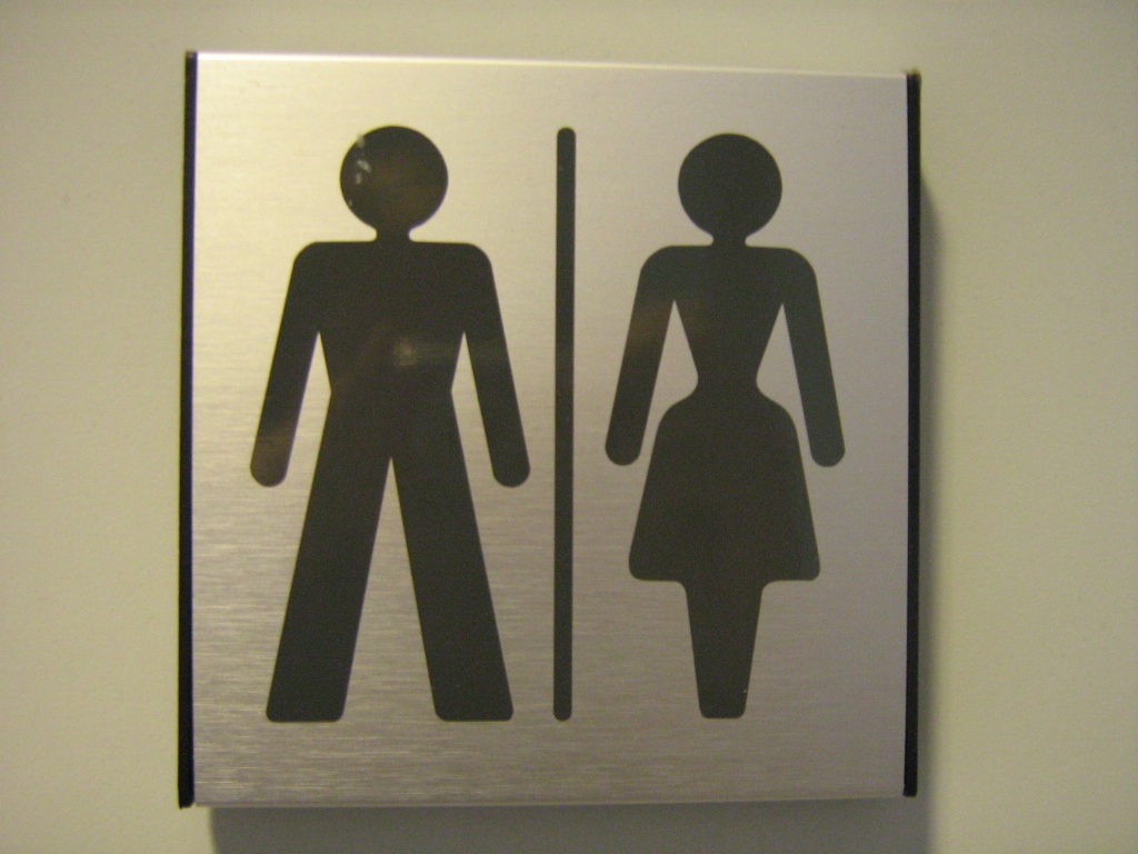 A photograph of a gender-neutral toilet sign.
