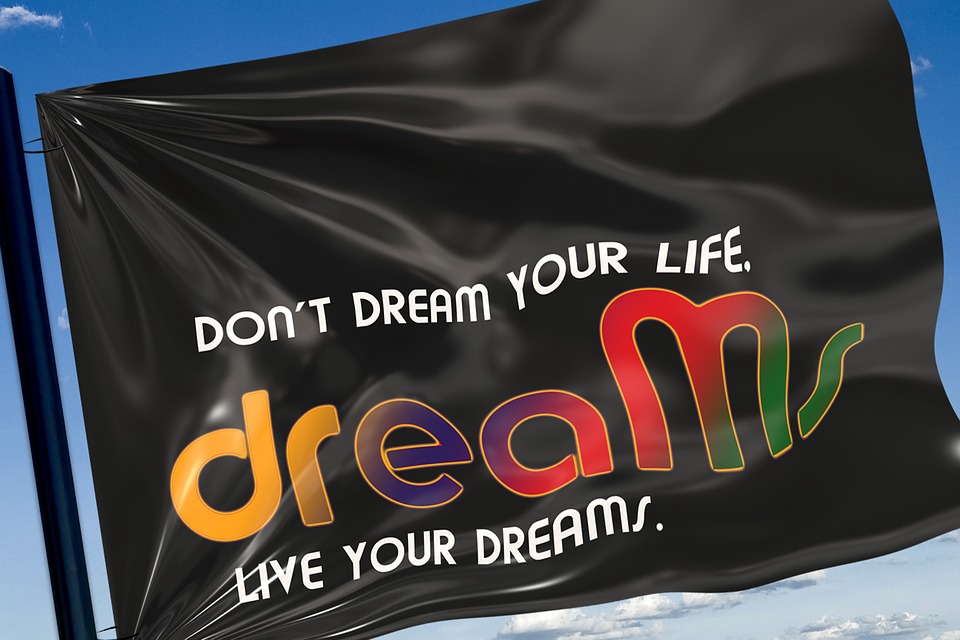 Photograph of a flag with the words "Don't Dream Your Life, Live Your dreams."