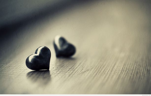 A black and white photo of two hearts.
