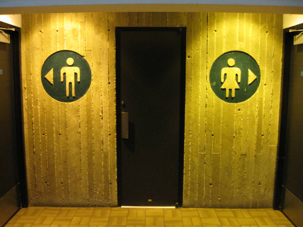 A photograph of doors to a public restroom.