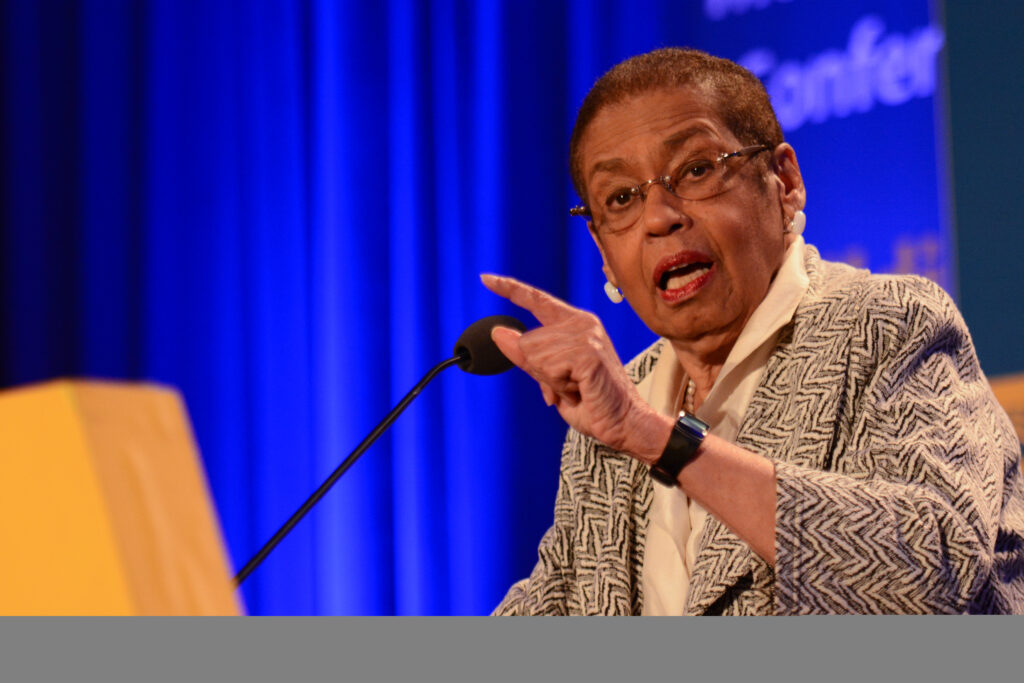 A photo showing Eleanor Holmes Norton speaking at a conference.