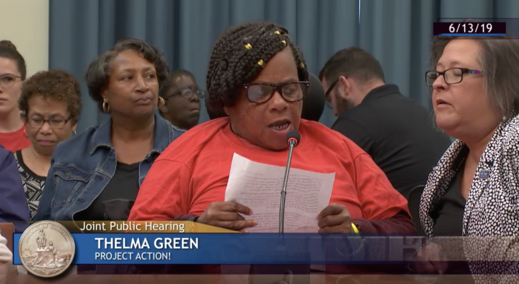 A photo of Thelma Green testifying at a hearing in June in favor of increasing pay for direct support professionals