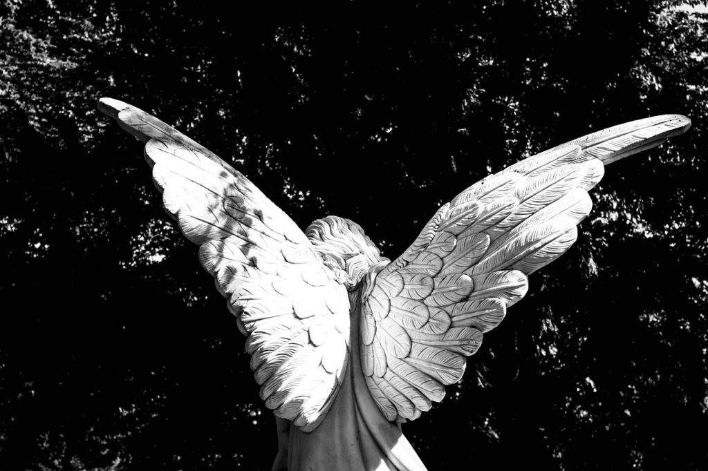 An angel statue with its wings spread
